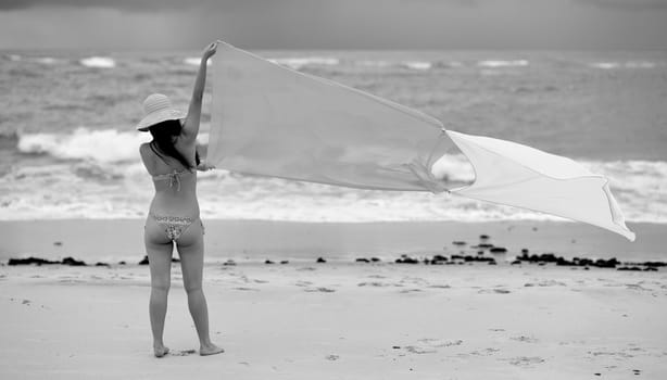 Woman enjoying the beach in Salvador de Bahia, Brazil