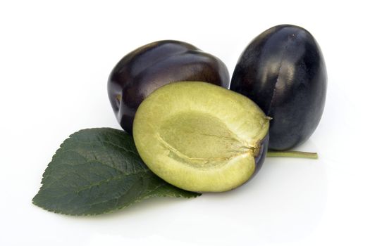 plums on the white background 