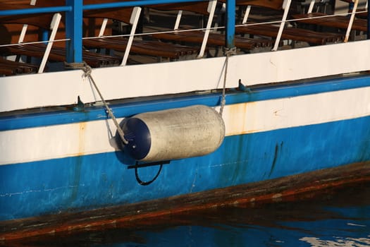 Traditional wooden boat hull part in a harbor
