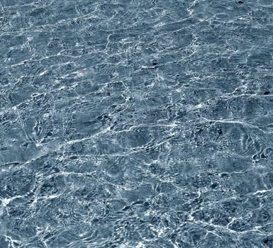 Transparent water in ocean. Blue abstract background