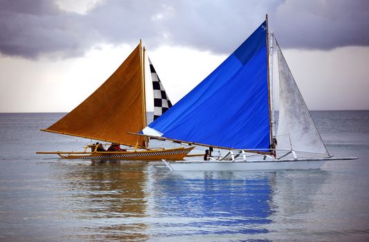 Two sailing boat at an open ocean