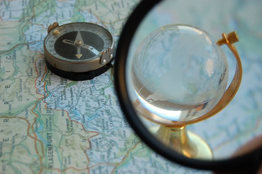 Map, globe and magnifying glass