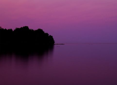 Flood Bay on the North Shore of Lake Superior in a magenta sunset