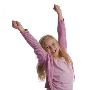 A girl in pink jumps for joy