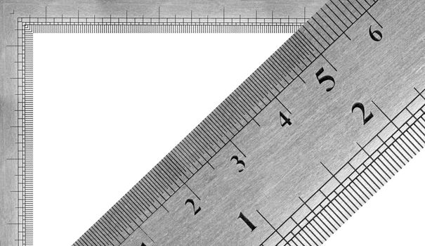 A fragment of a metal ruler with a textural covering
