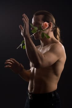 clambering romantic man with pink rose
