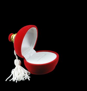 Casket under jewelry. The red and white satin on a black background