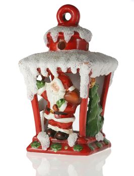 Christmas toy. A toy on a fur-tree with porcelain Santa Claus and fir - tree