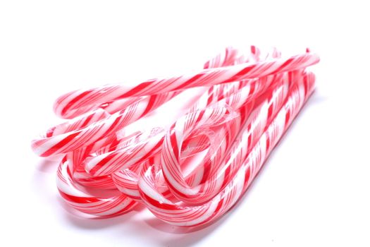 isolated shot of candy canes in a bundle on white background