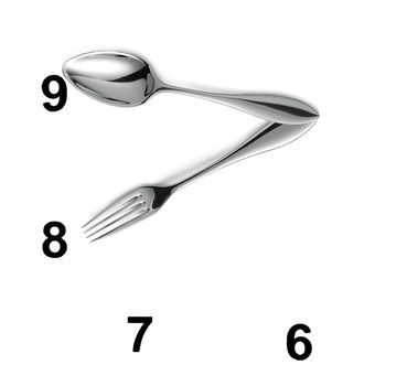 Clock made of spoon and fork isolated