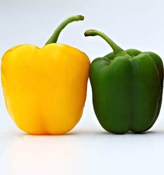 Two pepers isolated on a white background