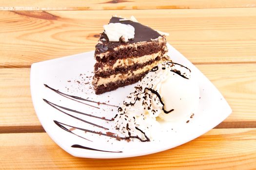 Chocolate brownie with vanilla ice-cream and chocolate sauce