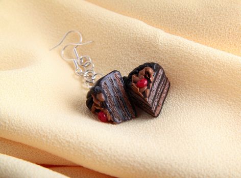 Fashion earrings with chocolate cake