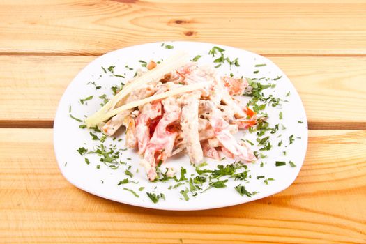 salad with tomato and meat on plate