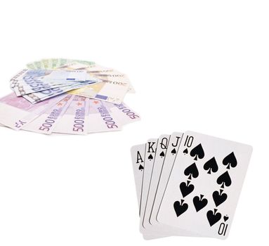 Playing cards and money on