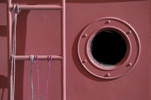 A window and stairs of an old fish ship