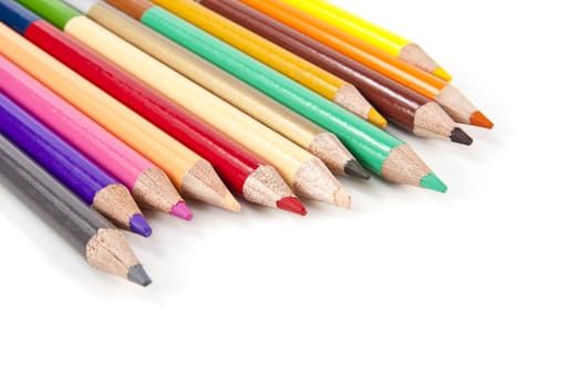 Color pencils in arrange in color wheel colors on white background