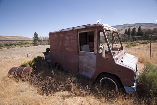 An old rusty abandoned car.