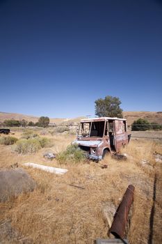 An old rusty abandoned car.