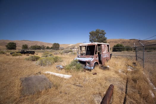 An old rusty abandoned car.