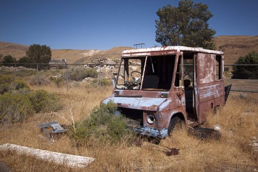 An old rusty abandoned car.