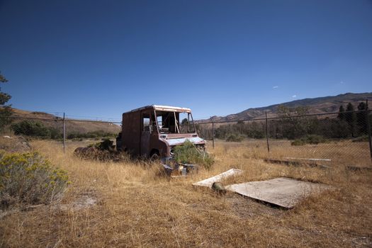 An old rusty abandoned car.