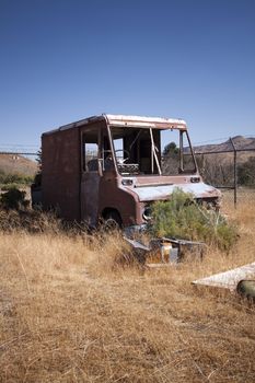 An old rusty abandoned car.