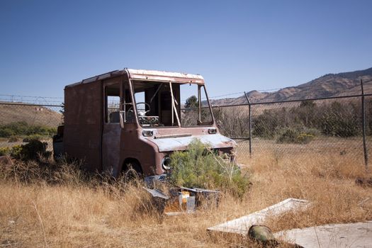 An old rusty abandoned car.