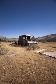 An old rusty abandoned car.