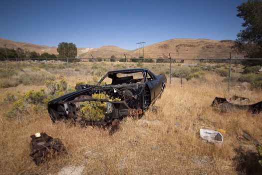 An old rusty abandoned car.
