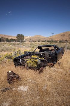 An old rusty abandoned car.