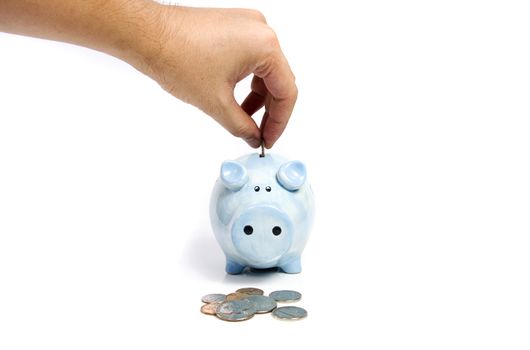 Human hand and blue piggy bank savings on white isolated