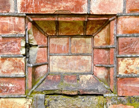 Old ancient gate made of red brick background. Architectural background.