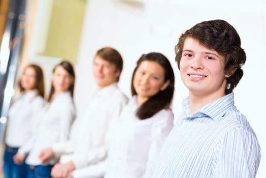 young businessmen standing in a row, the concept of teamwork