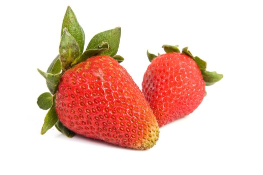 Image of two isolated strawberries with soft shadow.