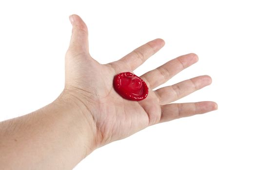 Condom in hand on the white background