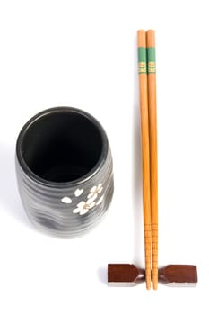 Chopsticks and tea bowl-japanese kitchen utensil on white background