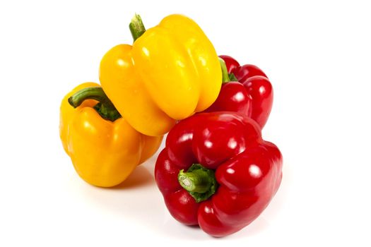 Yellow and red bell pepper on white background
