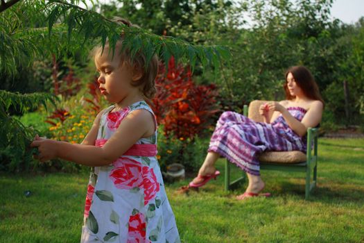 mother and daughter together in the garden