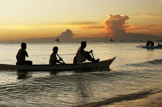 Sailing with a beautiful sunset in a tropical place