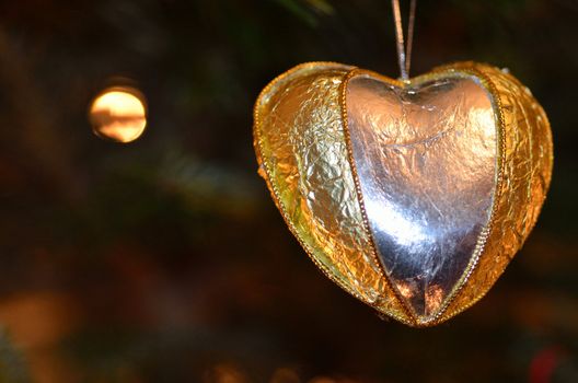 A golden heart christmas tree ornament.