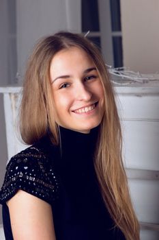 girl with blond long  hair in  dress playing white piano