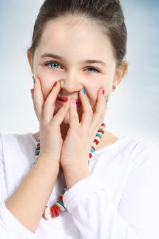 Little girl with colourful nails