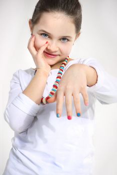 Little girl with colourful nails,closeup