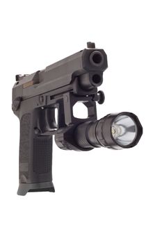 Looking down the barrel of a large 9mm automatic pistol with flashlight
