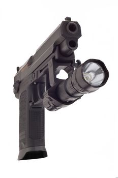 Looking down the barrel of a large 9mm automatic pistol with flashlight