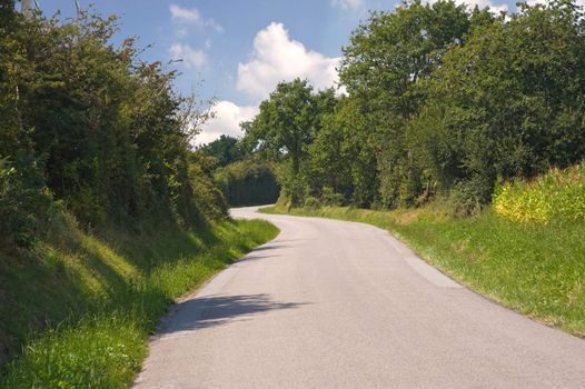 Winding french road in summer