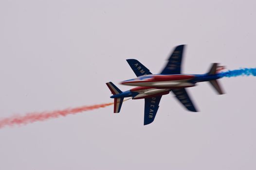 CERNY LA FERTÉ ALAIS, FRANCE - JUNE 12: Patrouille de France performing at Aerial Meeting "The propeller era" in Cerny La Ferté Alais, France on June 12, 2011