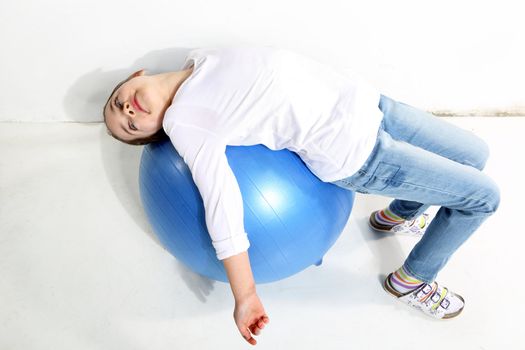 Little girl posing with a rubber ball