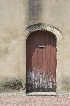 Rotten old French door with modern letterbox